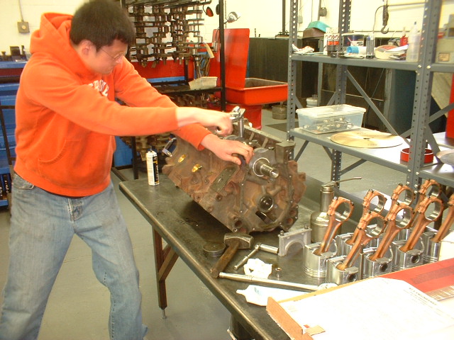 Kevin's torquing the main bolts preparing to install the piston rod assemblies